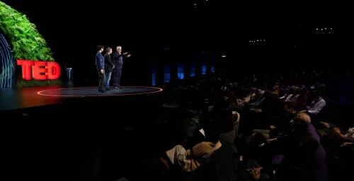 A group of people standing on top of a stage.