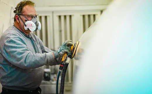 A photo of a man cleaning the truck