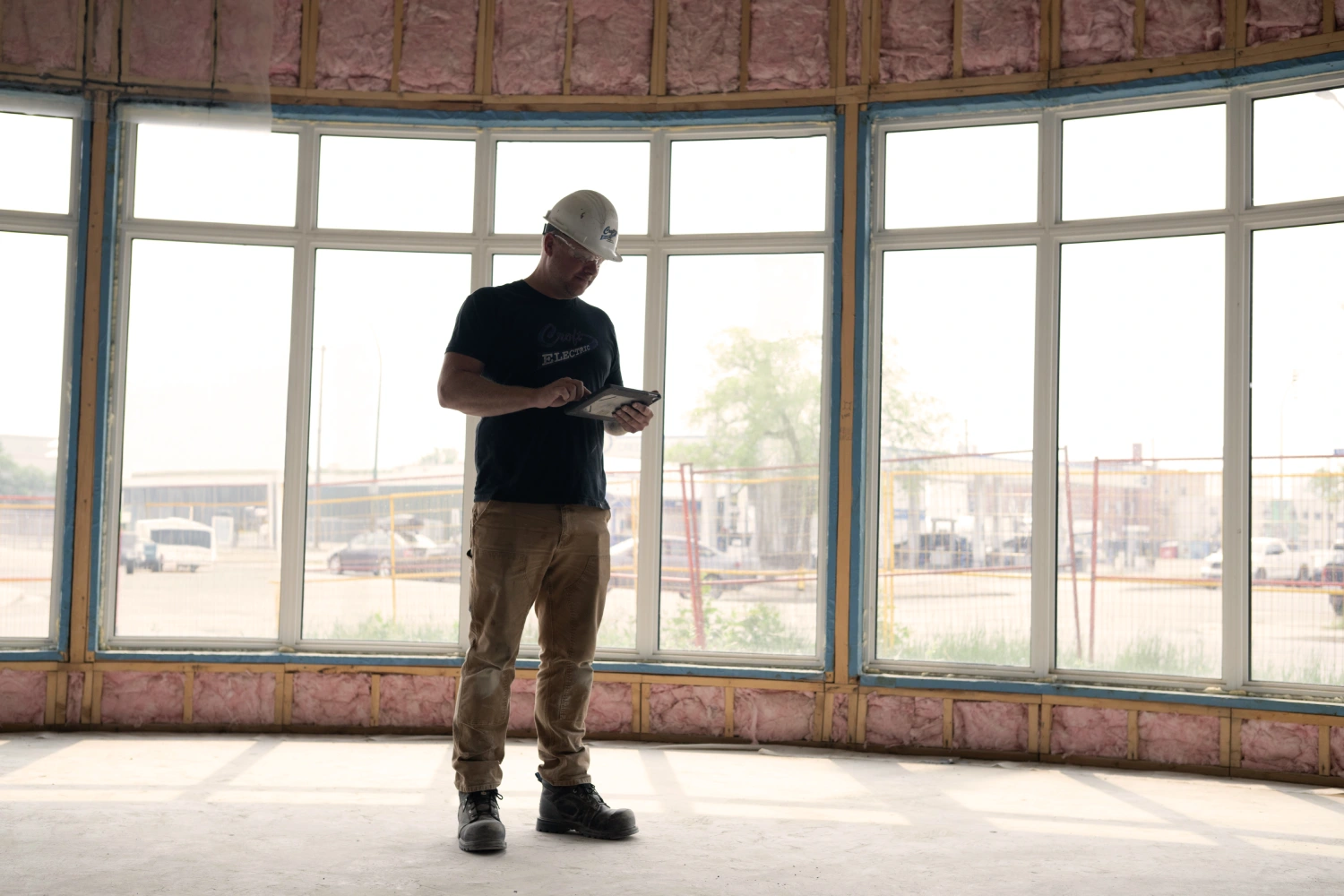Croft Electric commercial foreman using a tablet on a job site