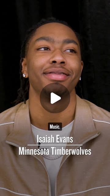 Isaiah Evans of the Minnesota Timberwolves smiling in a tan jacket, captioned: Music.