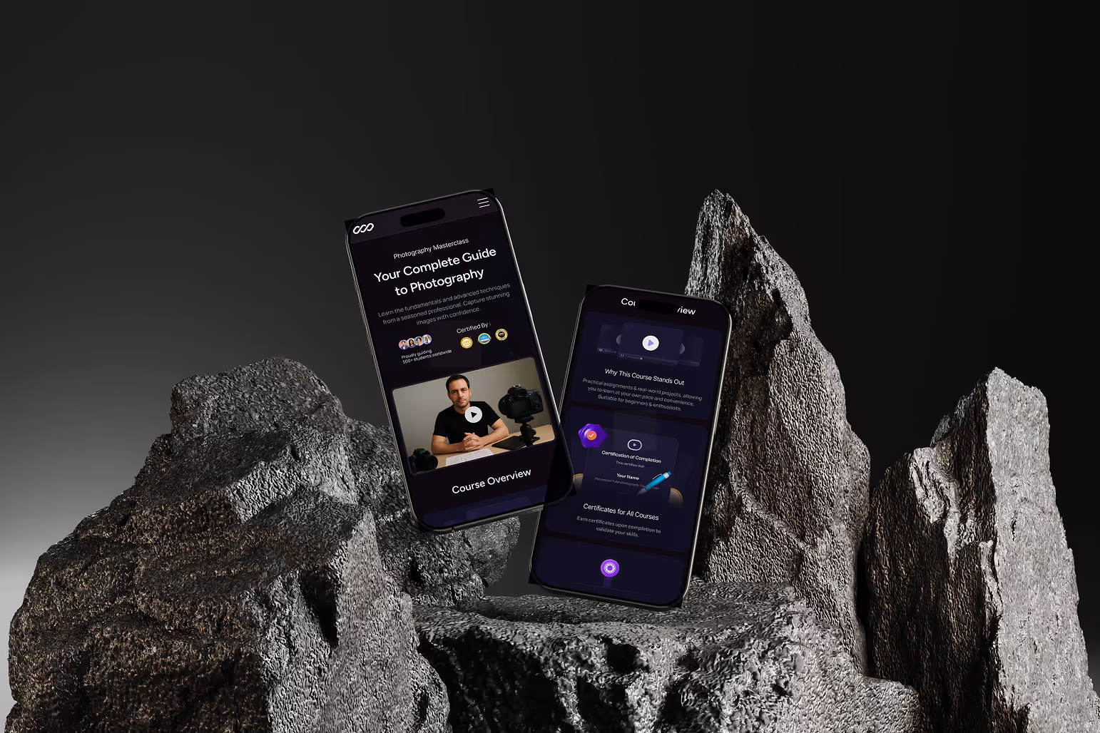 Two smartphones displaying mobile screens of a photography masterclass platform, presented in a dramatic rocky setting with a dark, high-contrast background.