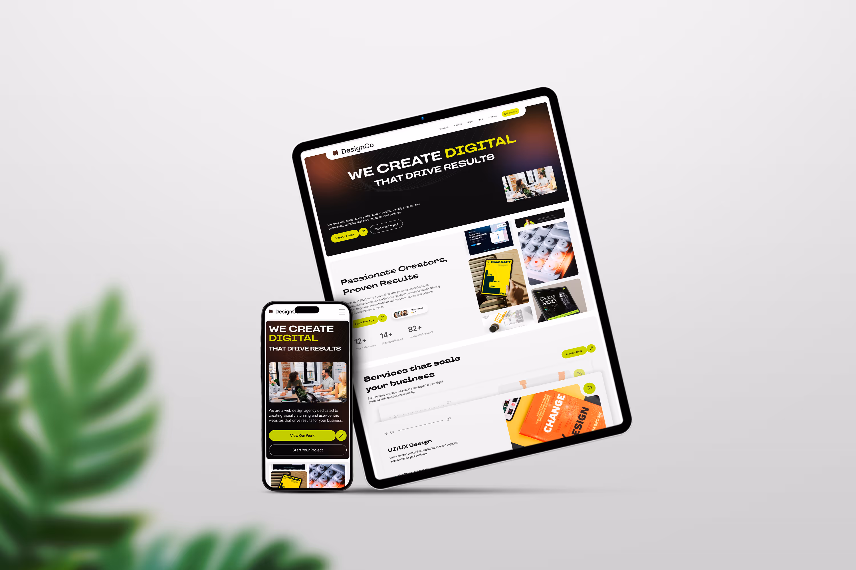 Tablet and smartphone showcasing the responsive layout of DesignCo's digital agency website with bold typography and modern grid layout, placed on a clean white background with plant detail.