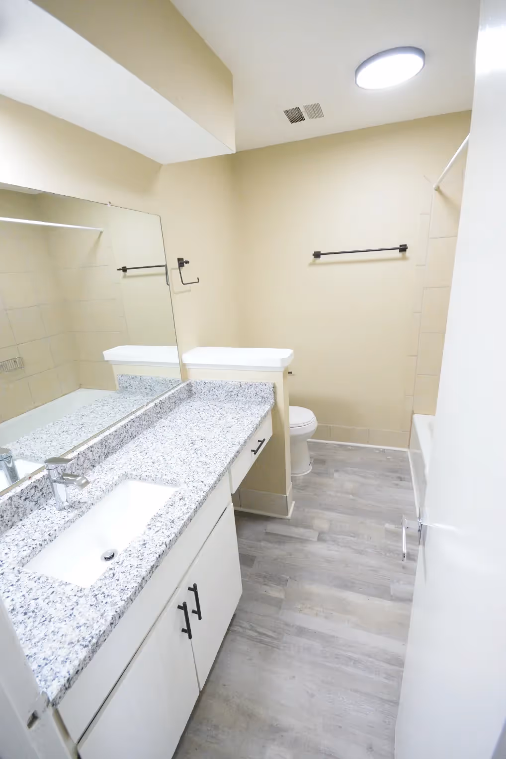 bathroom with granite counter top