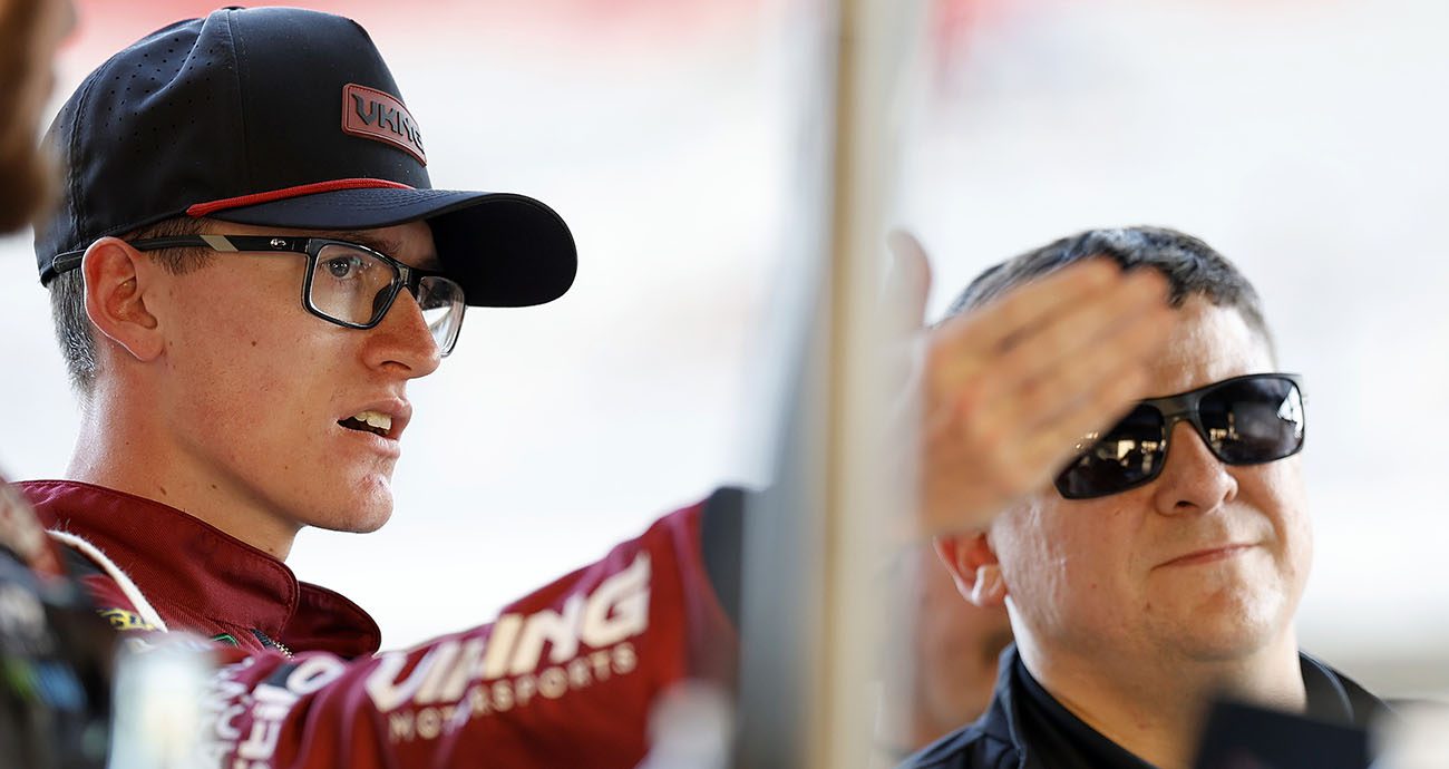 Parker Retzlaff looks on. 