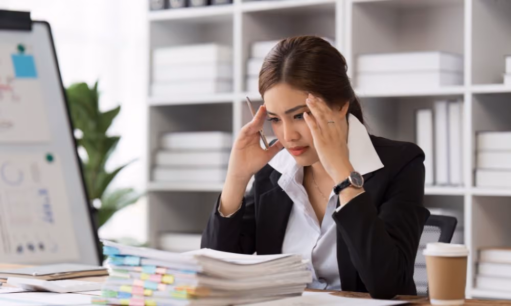 woman frustrated reading spreadsheets and information