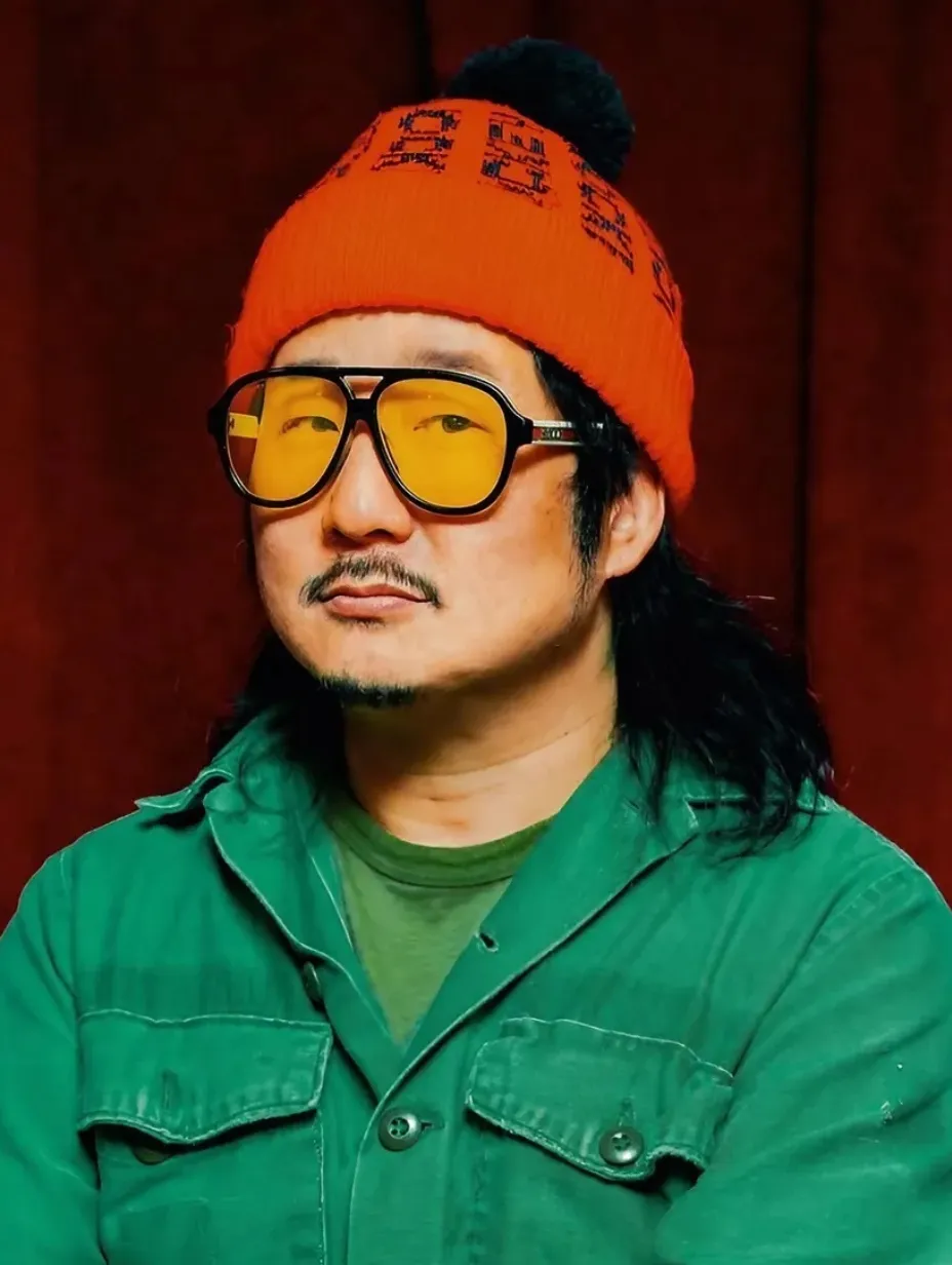 American comedian Bobby Lee in a red beanie and yellow glasses, a figure in London's stand up comedy scene