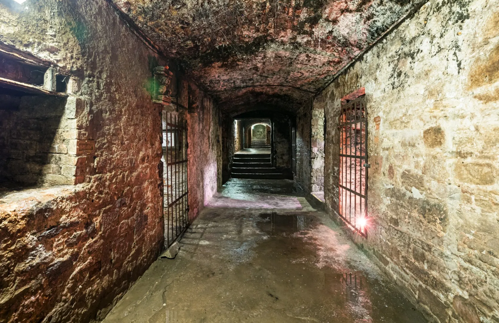 Edinburgh Vaults underground stone corridors showing historic haunted attraction.