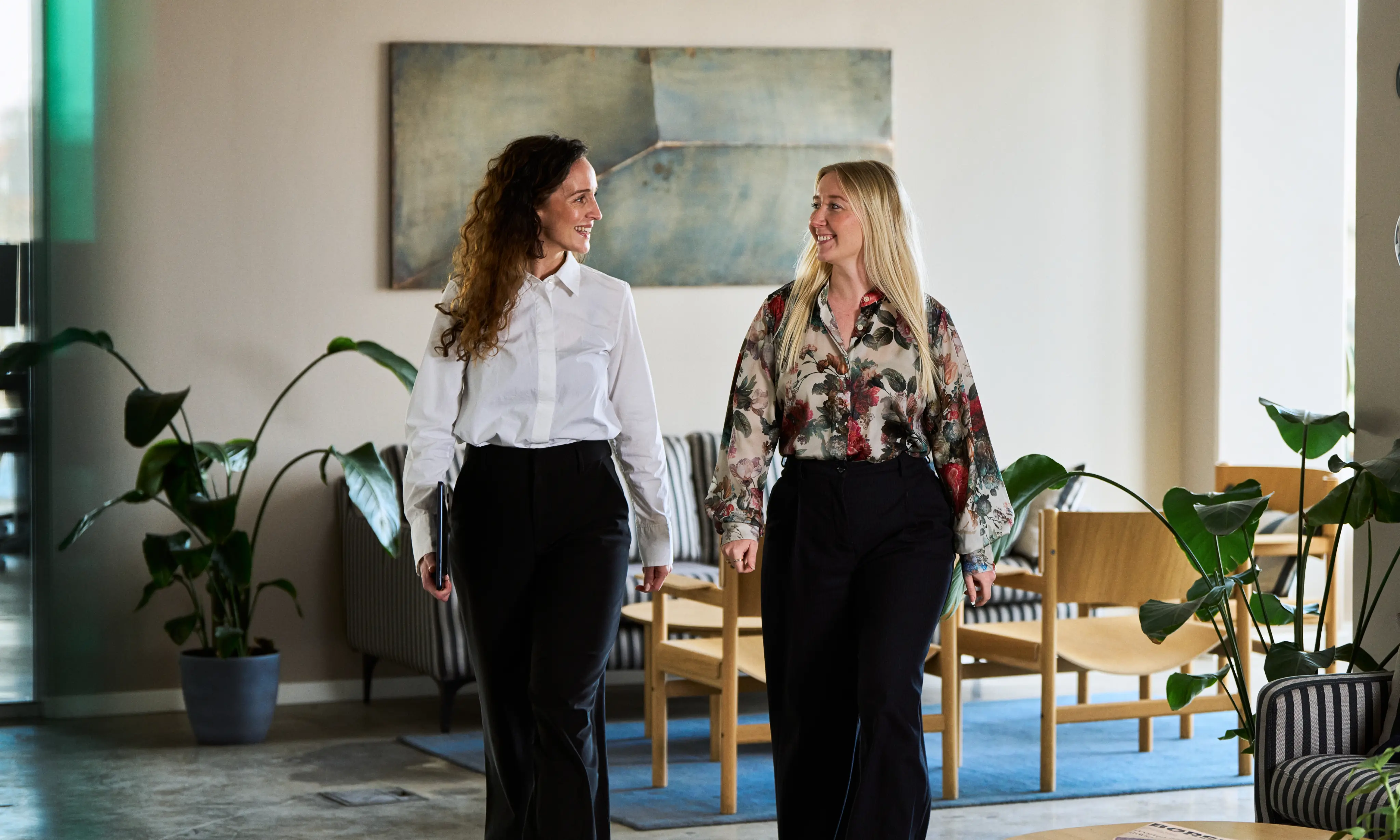 Two Obsidian colleagues walking through the office