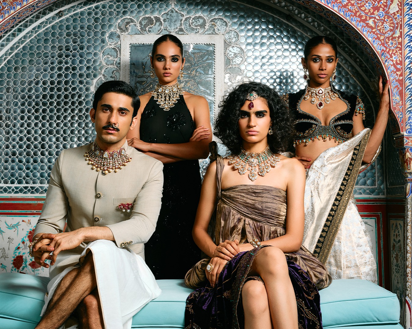 Models wearing Dusk from The Jaipur Edit by Raniwala 1881, hand-set men’s and women’s Polki necklaces, earrings and a maang tikka