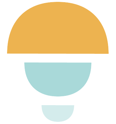 Abstract stacked stones in Director Zen orange and teal, balanced one on top of another.