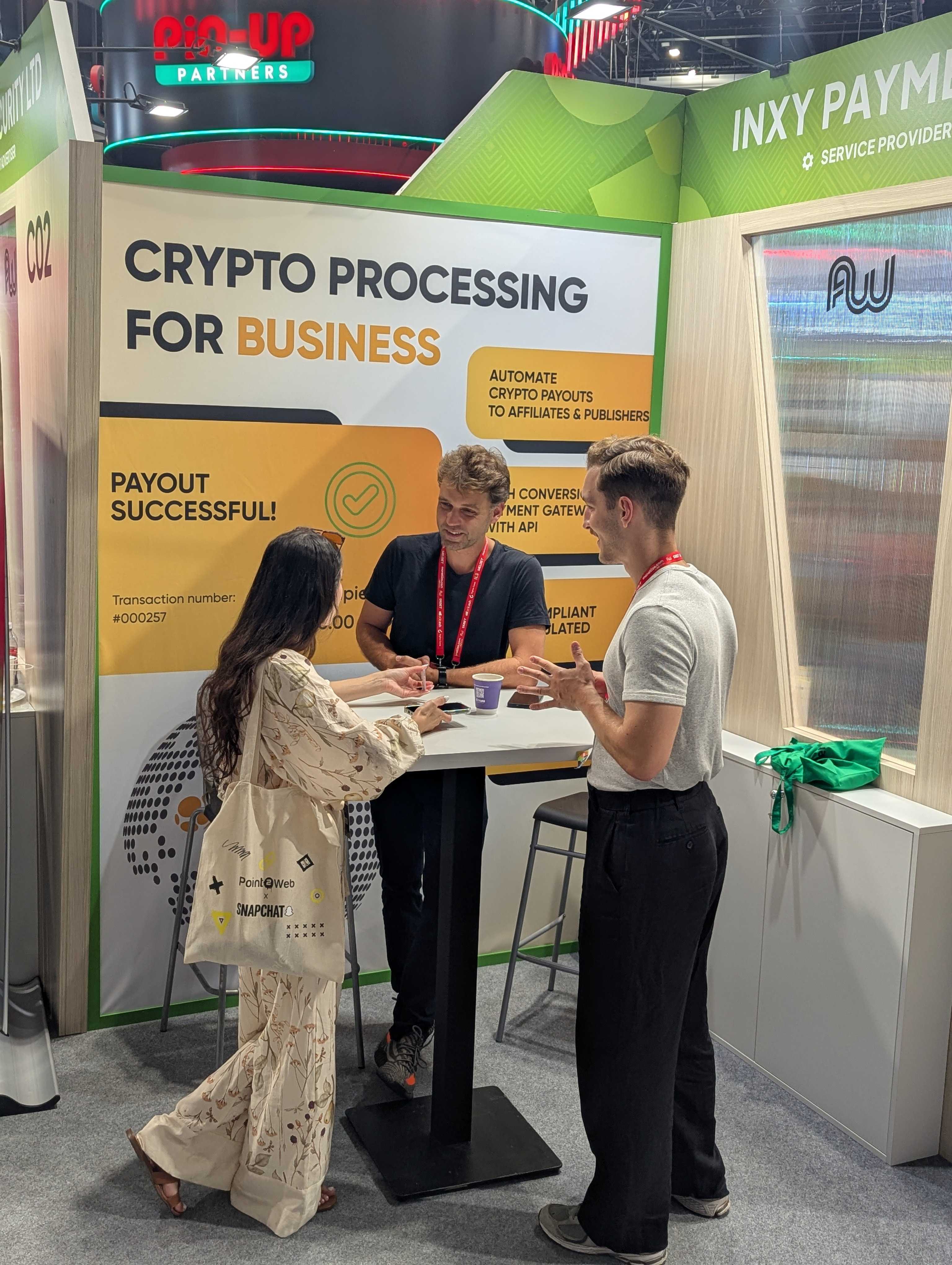 Conversation at the INXY Payments stand in Budapest