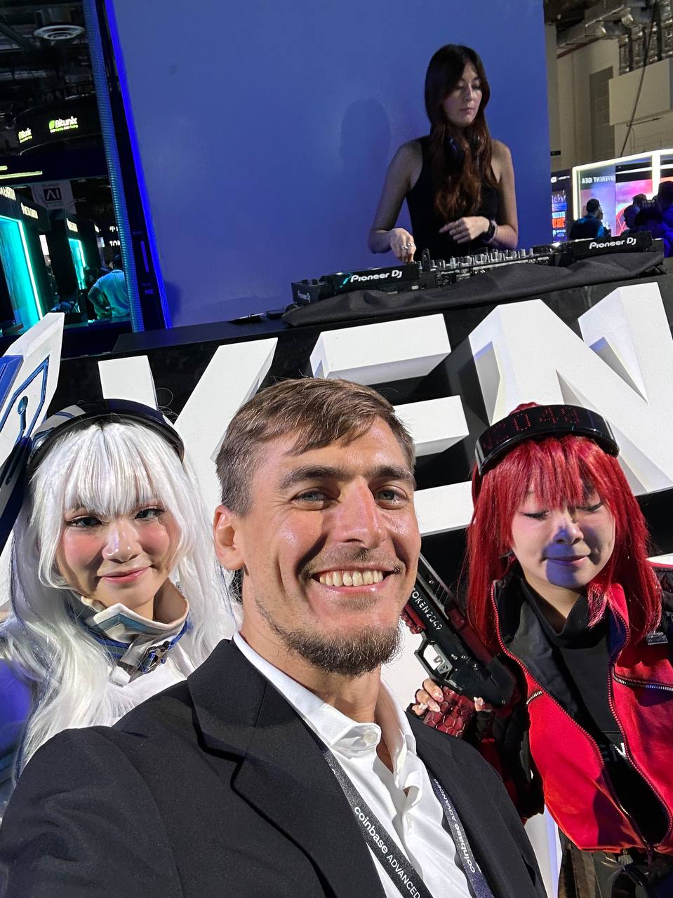 INXY Payments team member with costumed performers at TOKEN2049