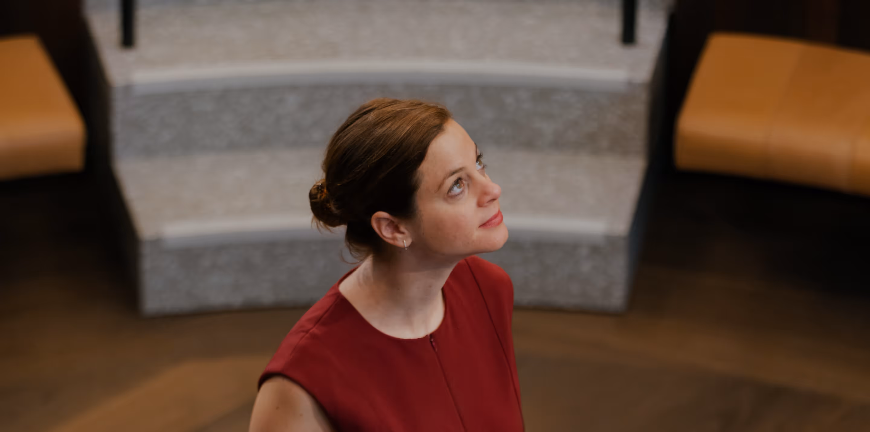 Woman in an amphitheater looking