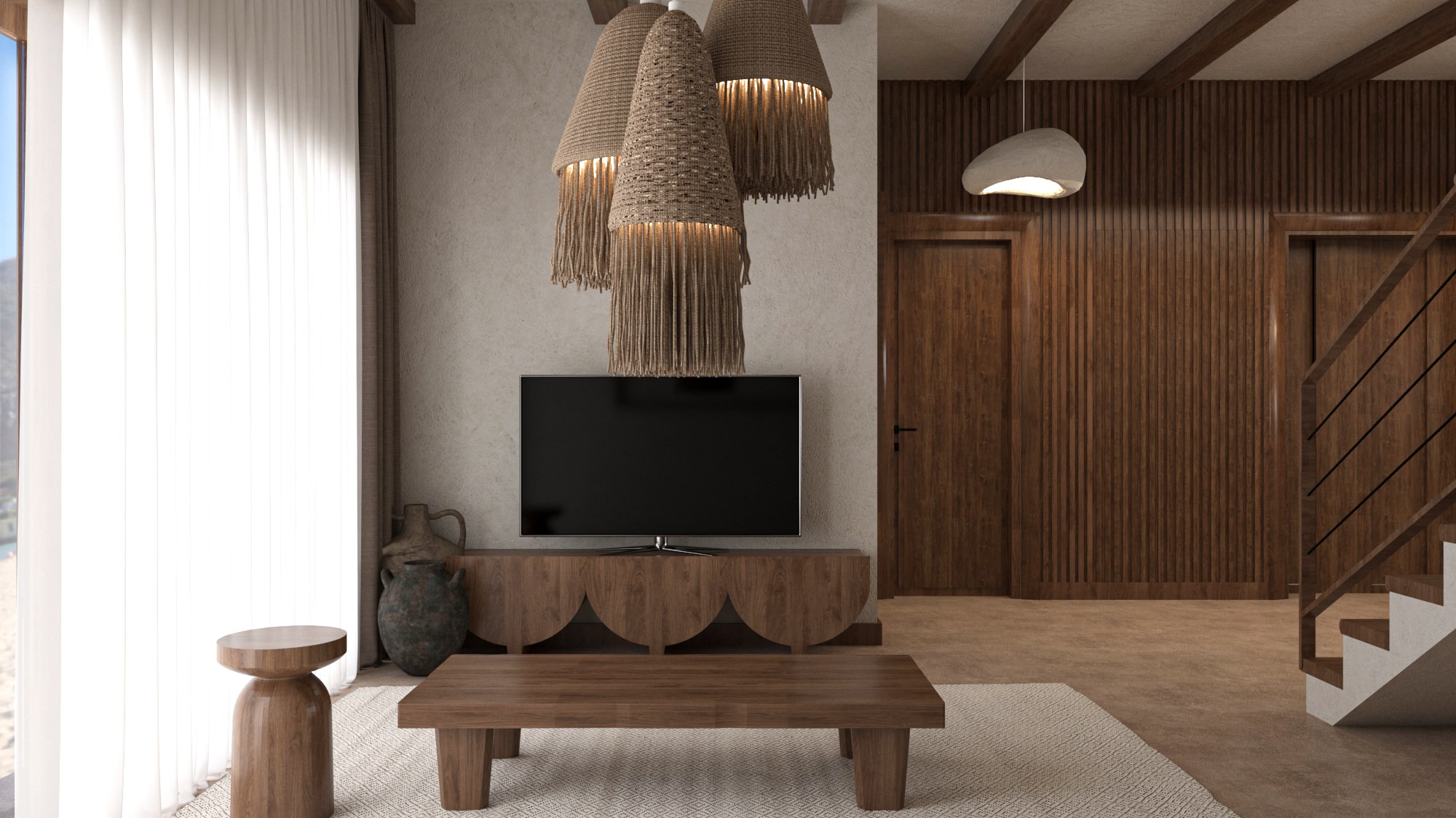 Cozy corner of the Asili Penthouse living room showing the television area with a sculptural wooden TV console and a cluster of woven raffia pendant light fixtures.