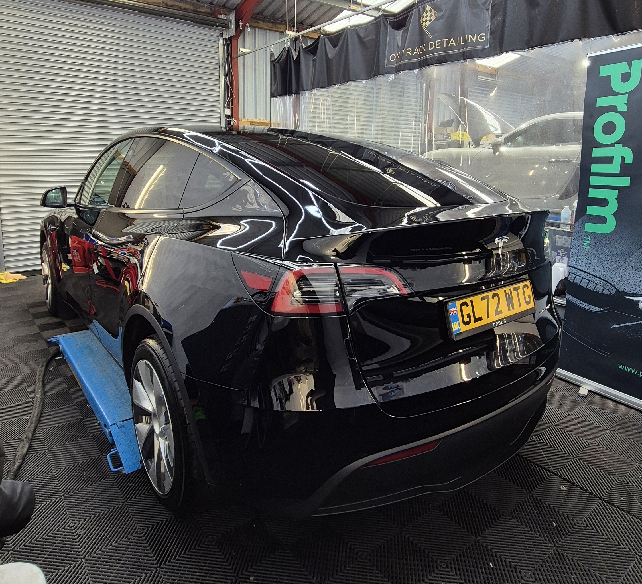 Tesla Model Y with Front End PPF and Multi Stage Correction with Ceramic Coating on the whole vehicle.