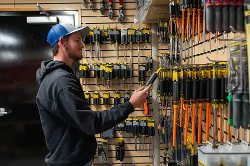 Man looking at tools