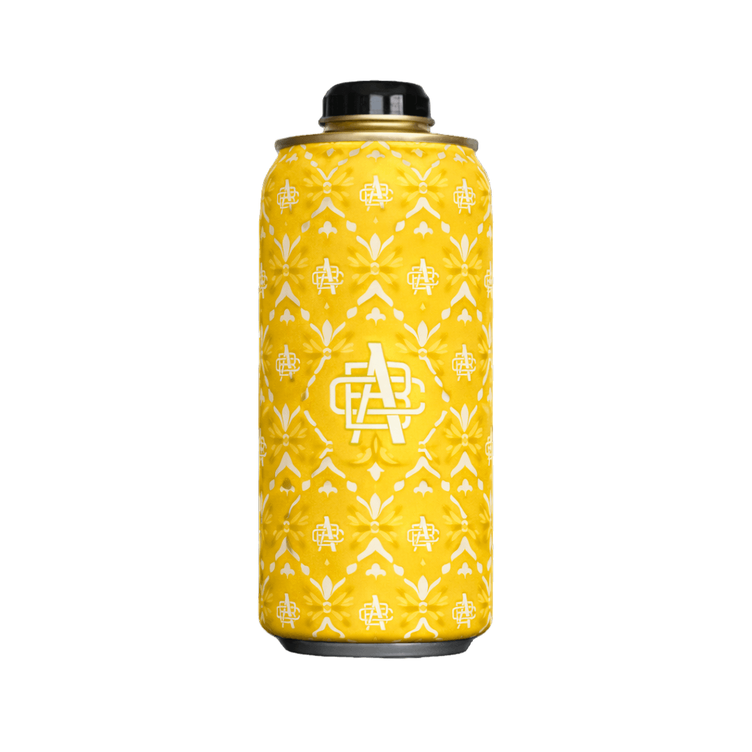 Yellow can cooler sleeve with white decorative patterns and logo, holding a metal can with a black cap.
