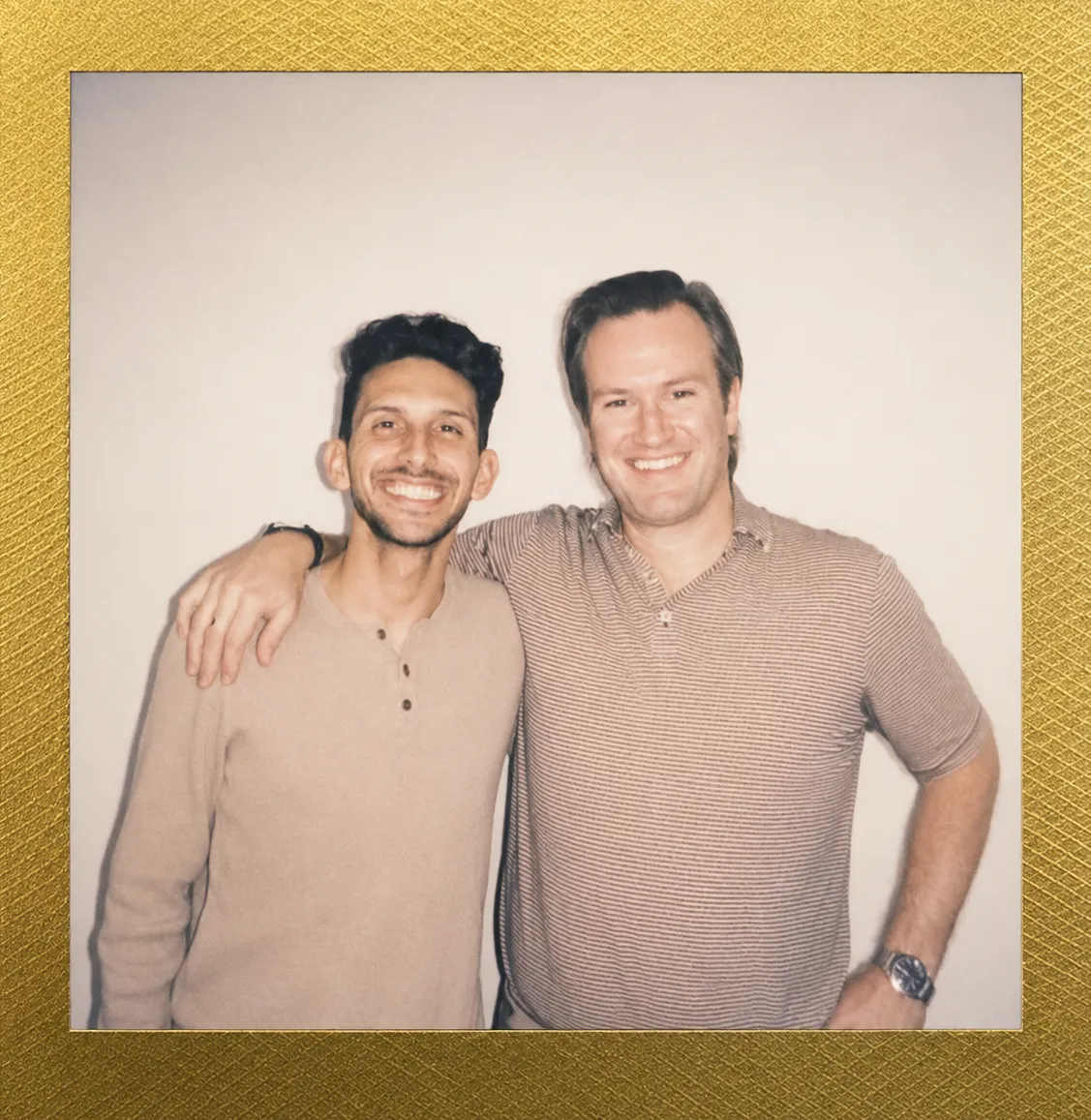 Dilan and Dr. Reynolds Lawnin smiling together, polaroid-style photo