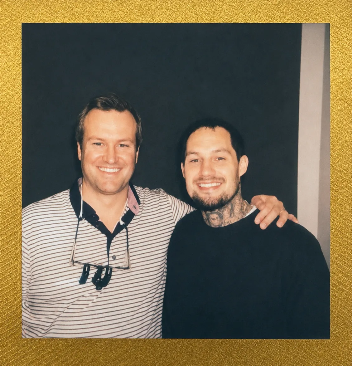 Sean and Dr. Reynolds Lawnin smiling together, polaroid-style photo