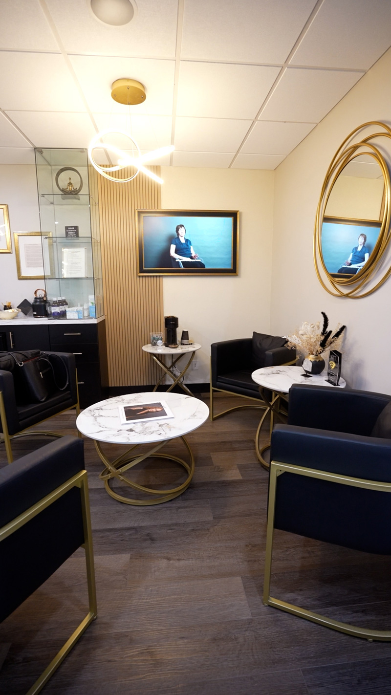 Patient lounge with navy and gold seating at Inspire Smiles in Solana Beach
