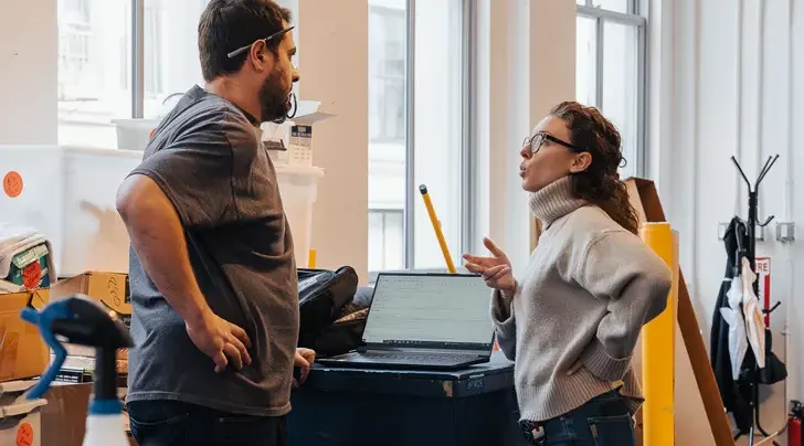 Two people talking to one another