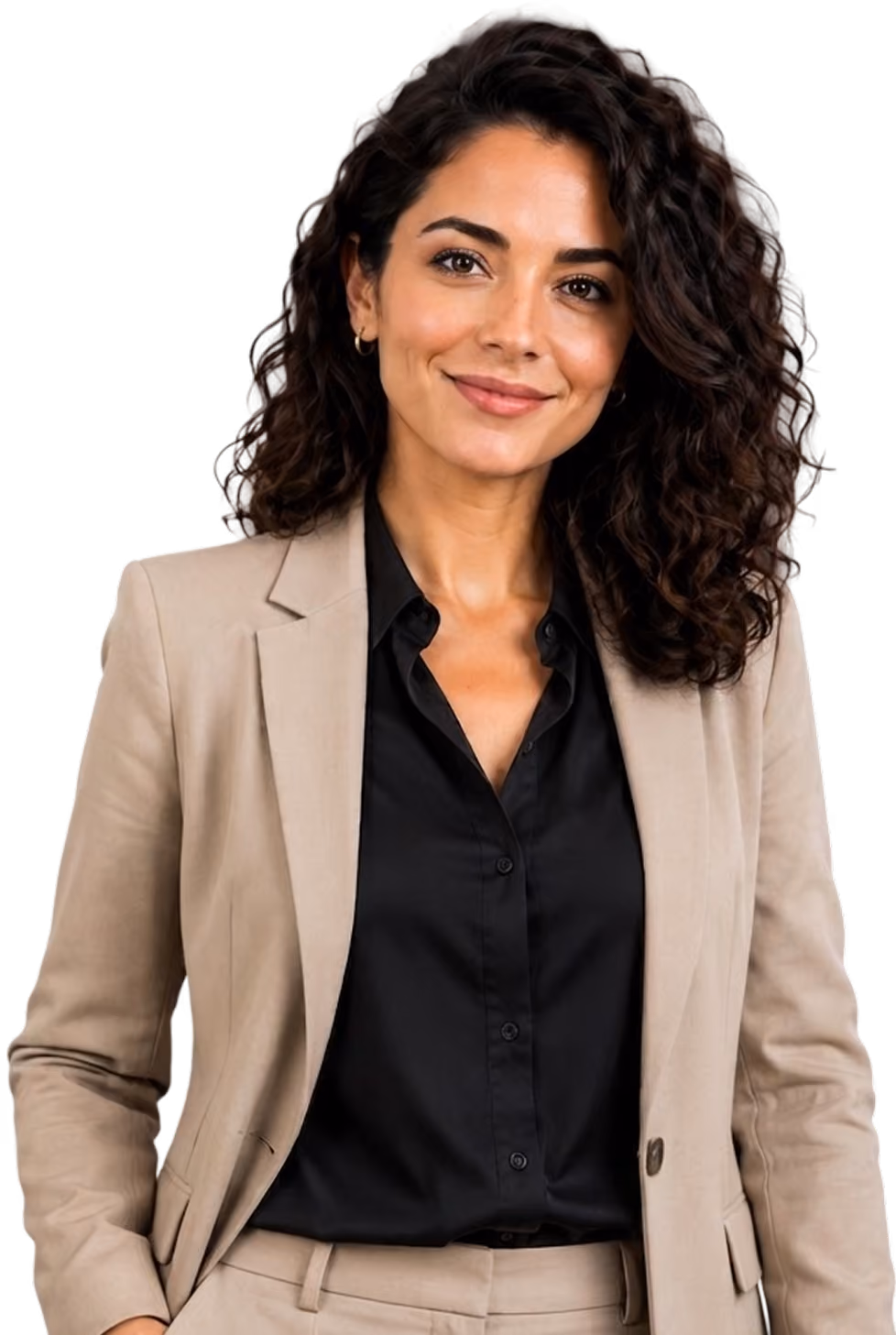 Confident woman with curly dark hair wearing a beige suit and black shirt, smiling softly.