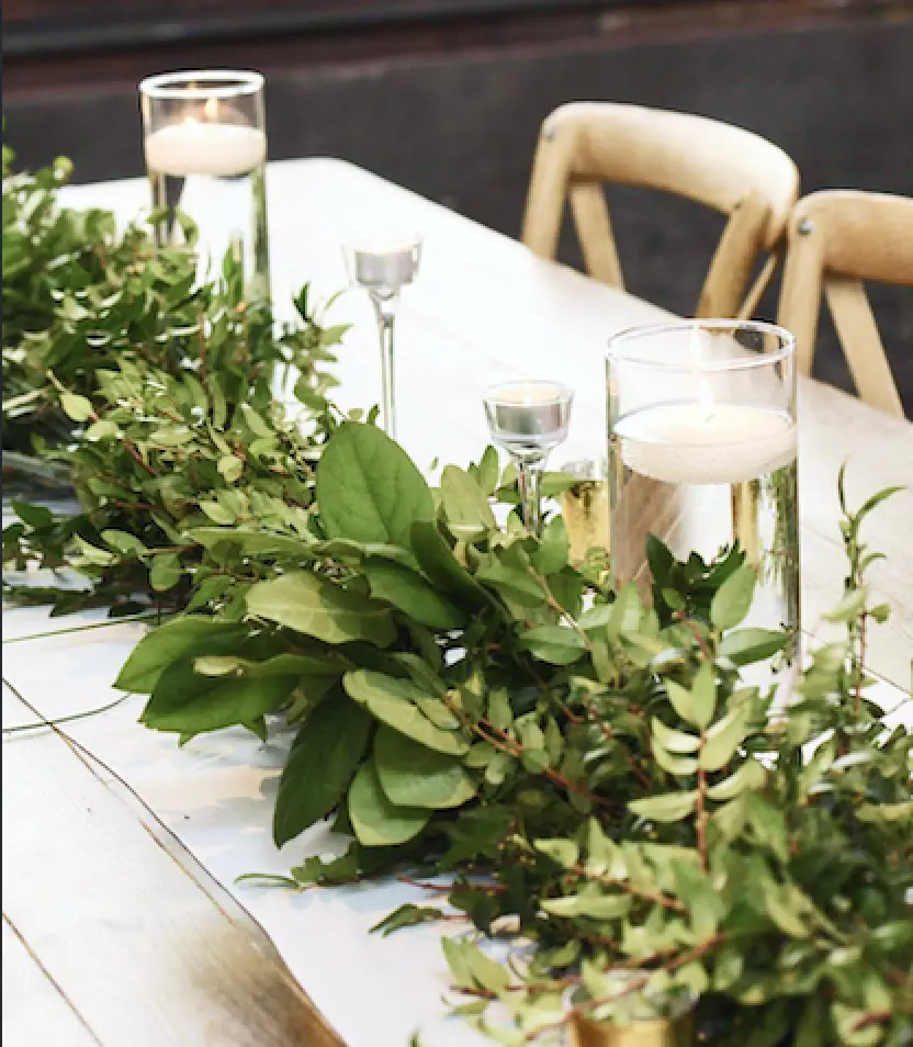 Fresh greenery and candles close-up
