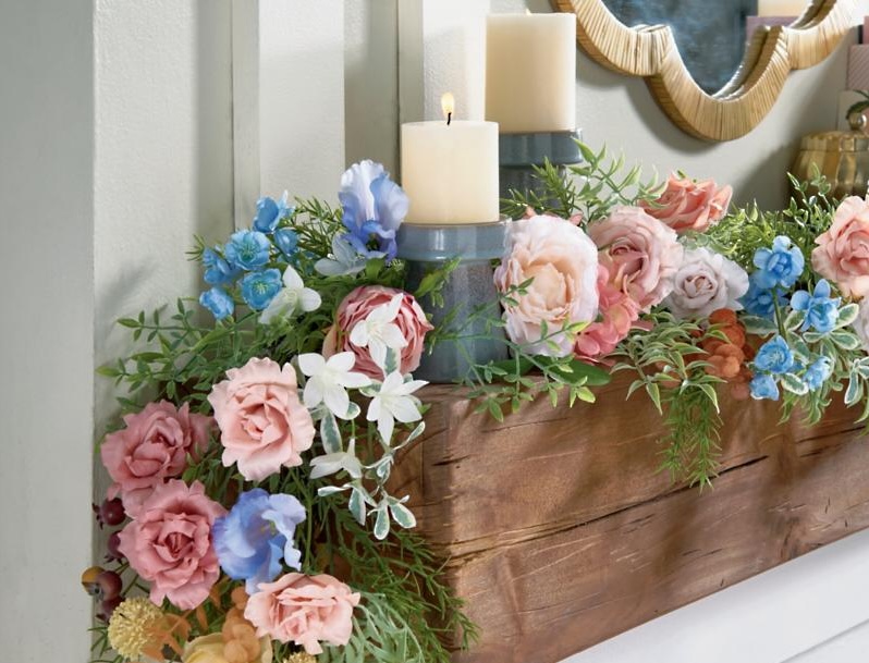 Table with faux flower garland centerpiece