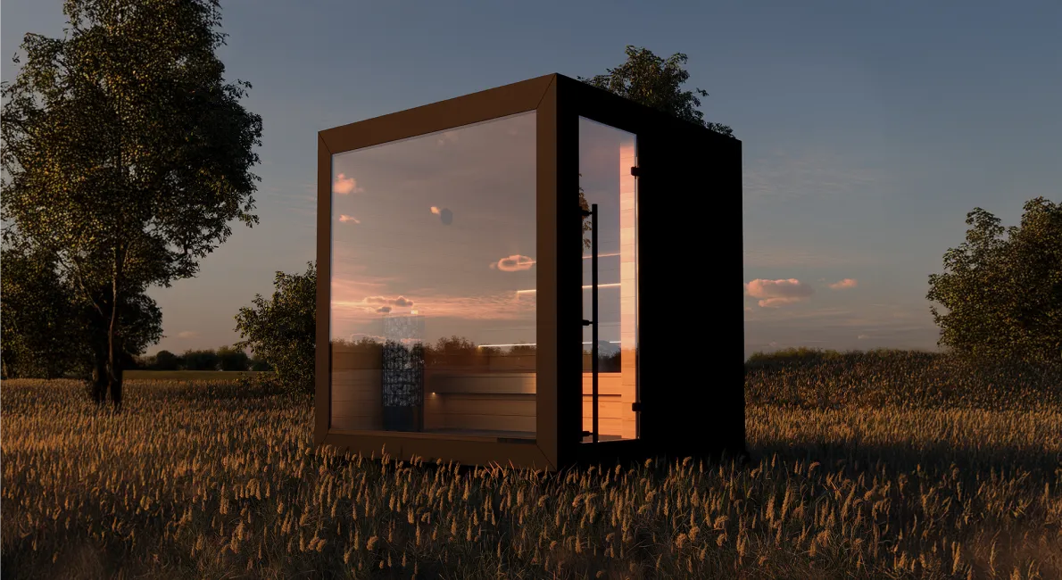 Nowoczesna sześcienna sauna z wnętrzem podświetlonym ciepłym pomarańczowym światłem, umieszczona w ogrodzie nocą.