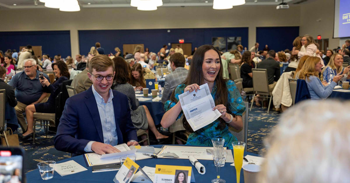 Groups of ETSU students learning where they will spend their residency at Match Day