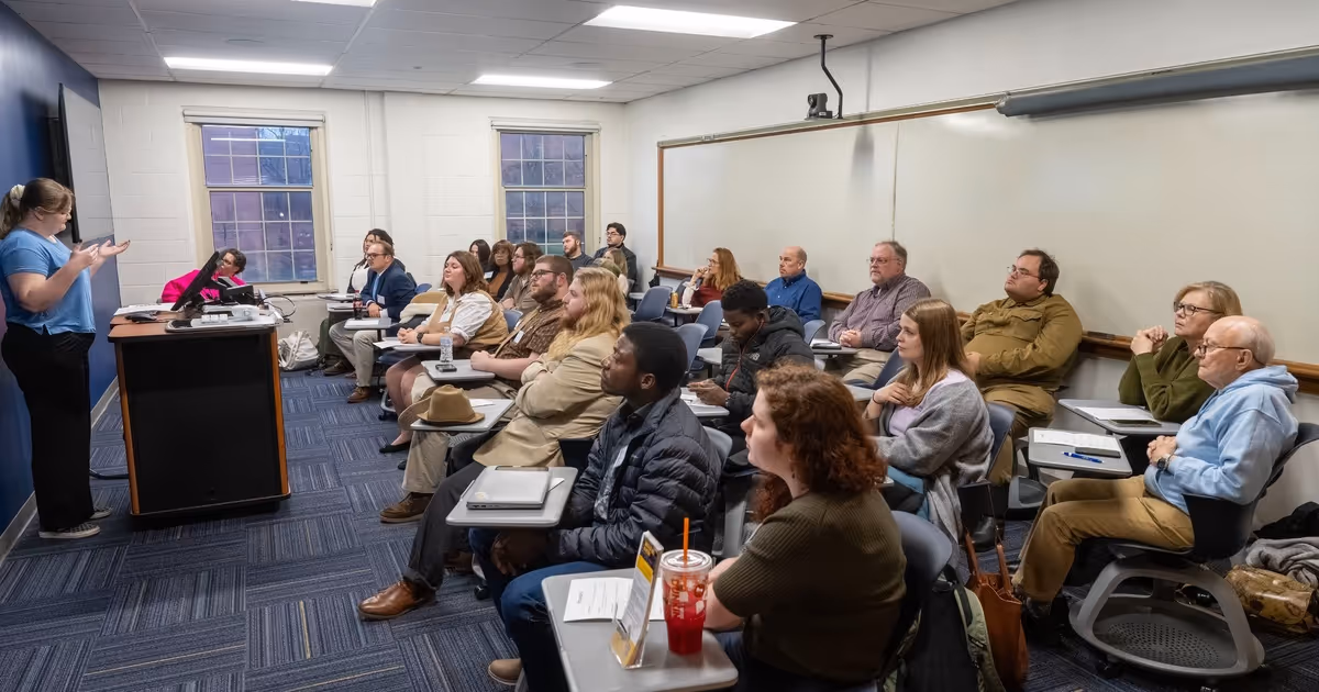 A room is packed with listeners during the 2025 History Graduate Research Conference.