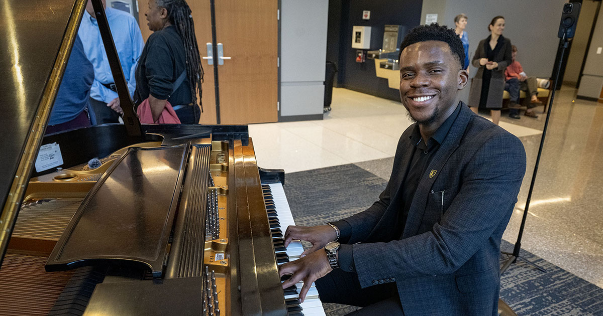 An ETSU student pianist performs in the lobby as guests gather for the Mary B. Martin School of the Arts Showcase.