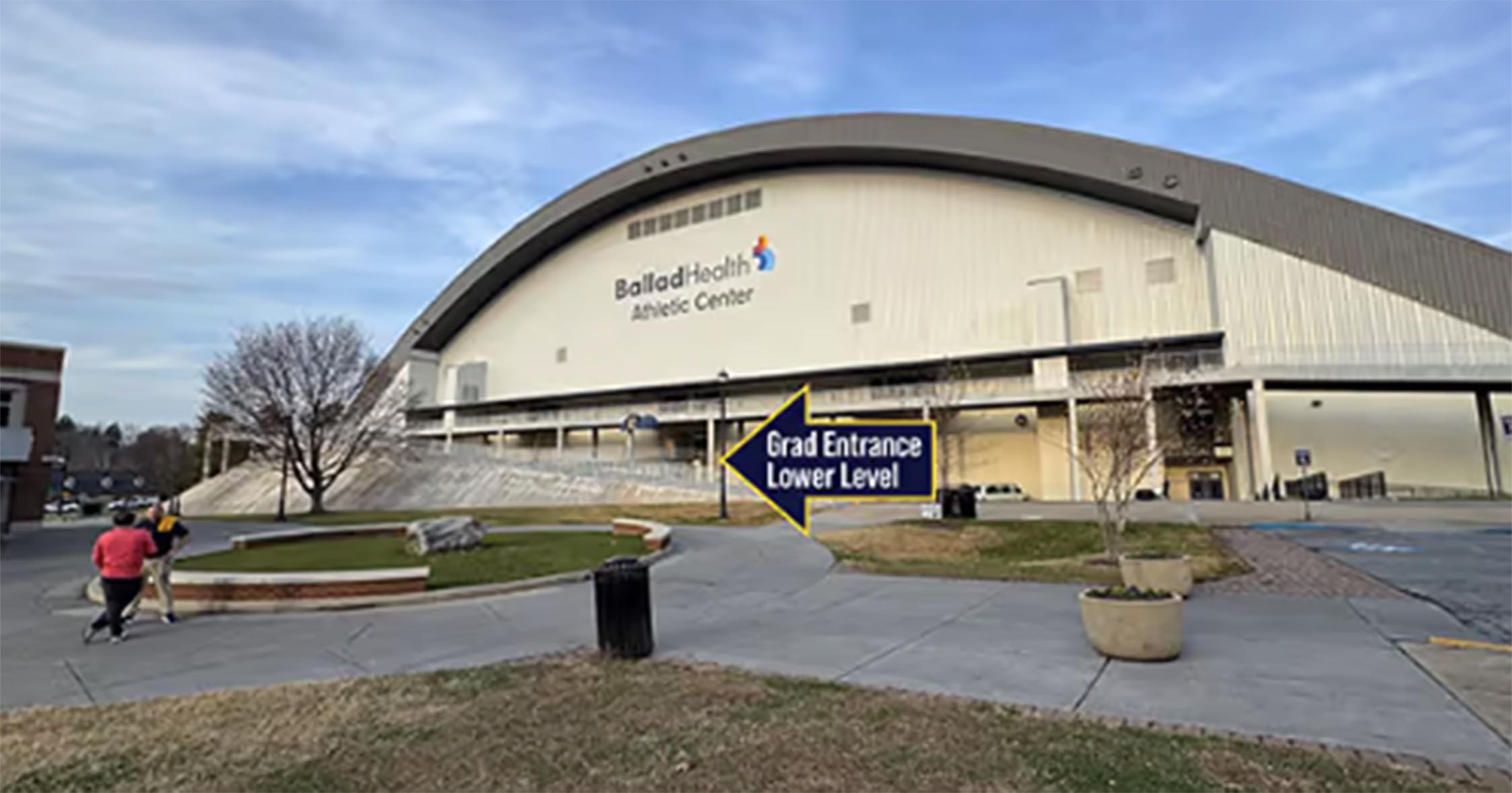 Ballad Health Athletic Center exterior with signage directing graduates to the lower-level entrance.