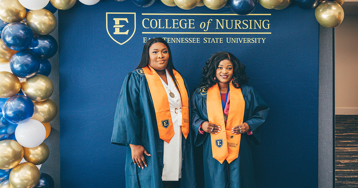 Two graduates from the Spring 2026 Class of ETSU's College of Nursing pose for photos
