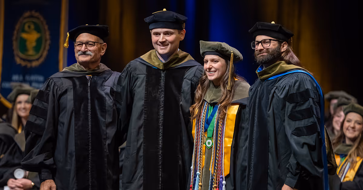 A group of grads pose for a photo