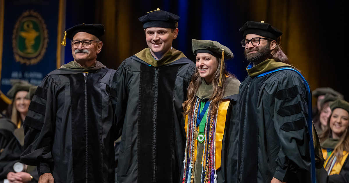 A group of grads pose for a photo