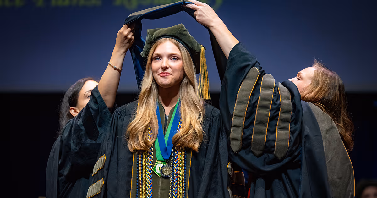 A student is hooded