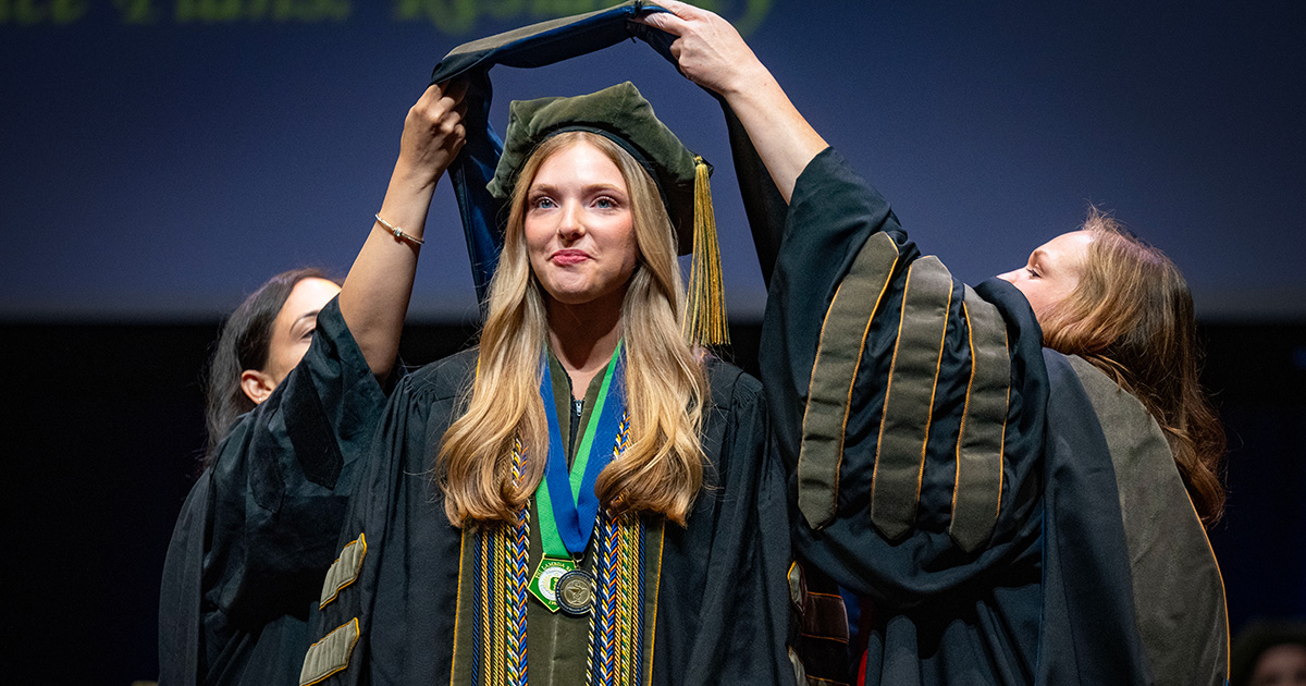 A student is hooded