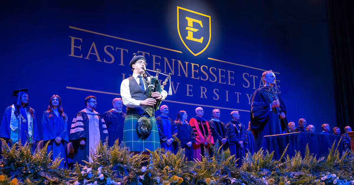 A bagpiper plays at ETSU's spring 2026 commencement ceremony