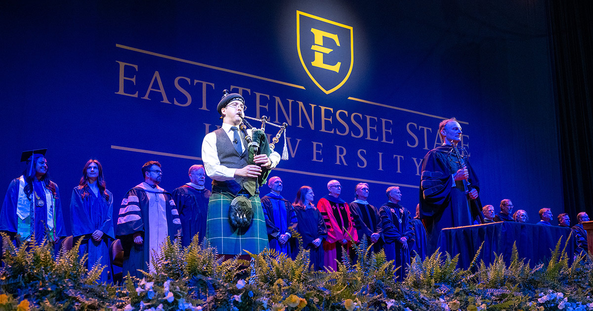 A bagpiper plays at ETSU's spring 2026 commencement ceremony