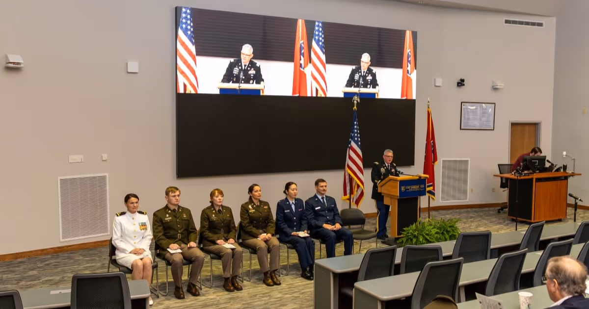 Quillen's military students sit in a row during a speaker's presentation at the Quillen College of Medicine's military promotion ceremony. 