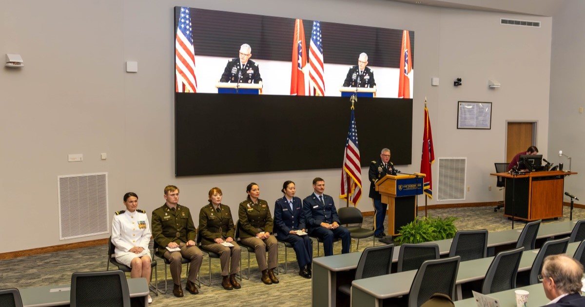 Quillen's military students sit in a row during a speaker's presentation at the Quillen College of Medicine's military promotion ceremony. 