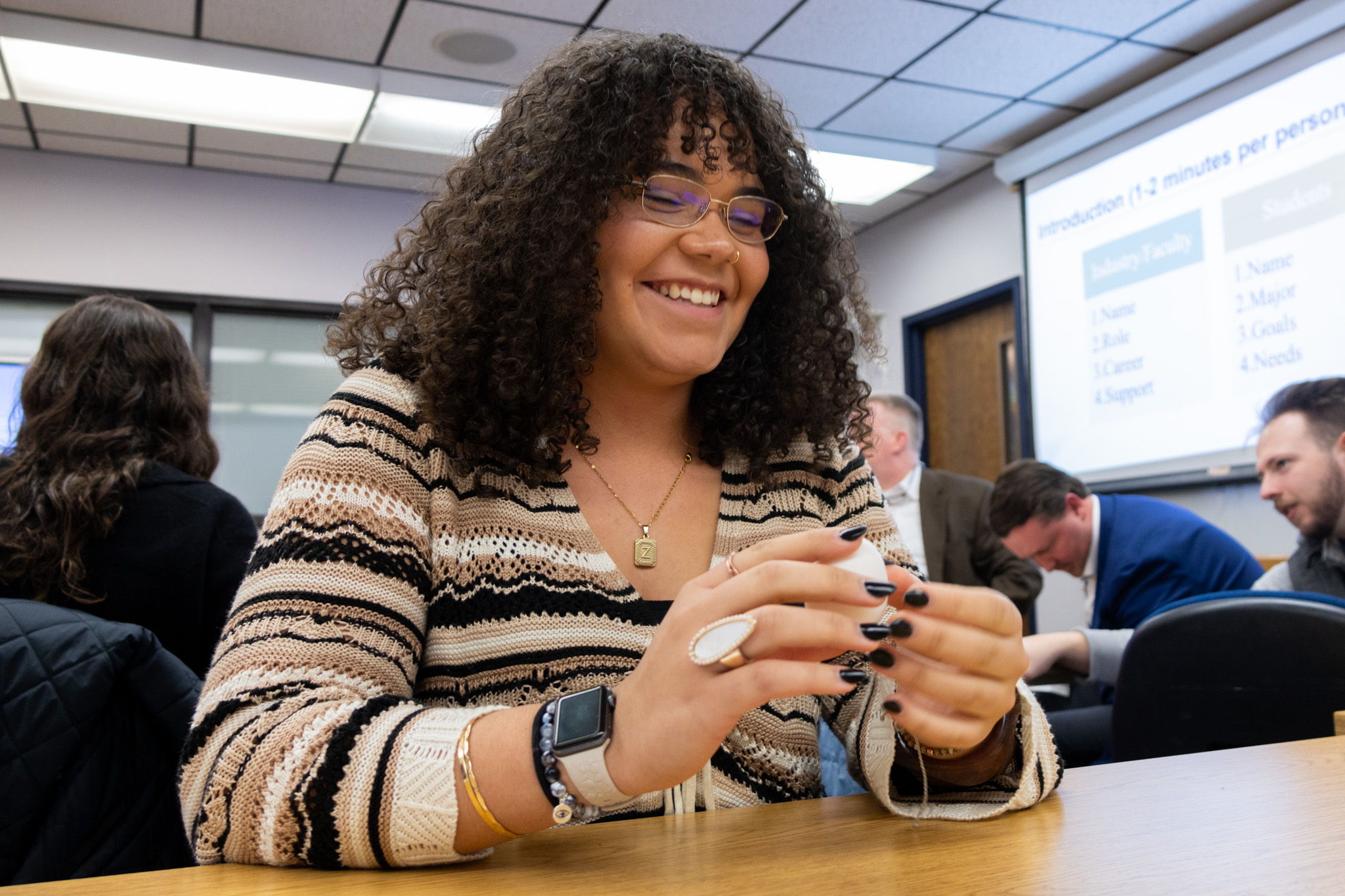 ETSU CBAT student Zoe Luttrell smiles as her interacts with a BucGuide Academy activity.