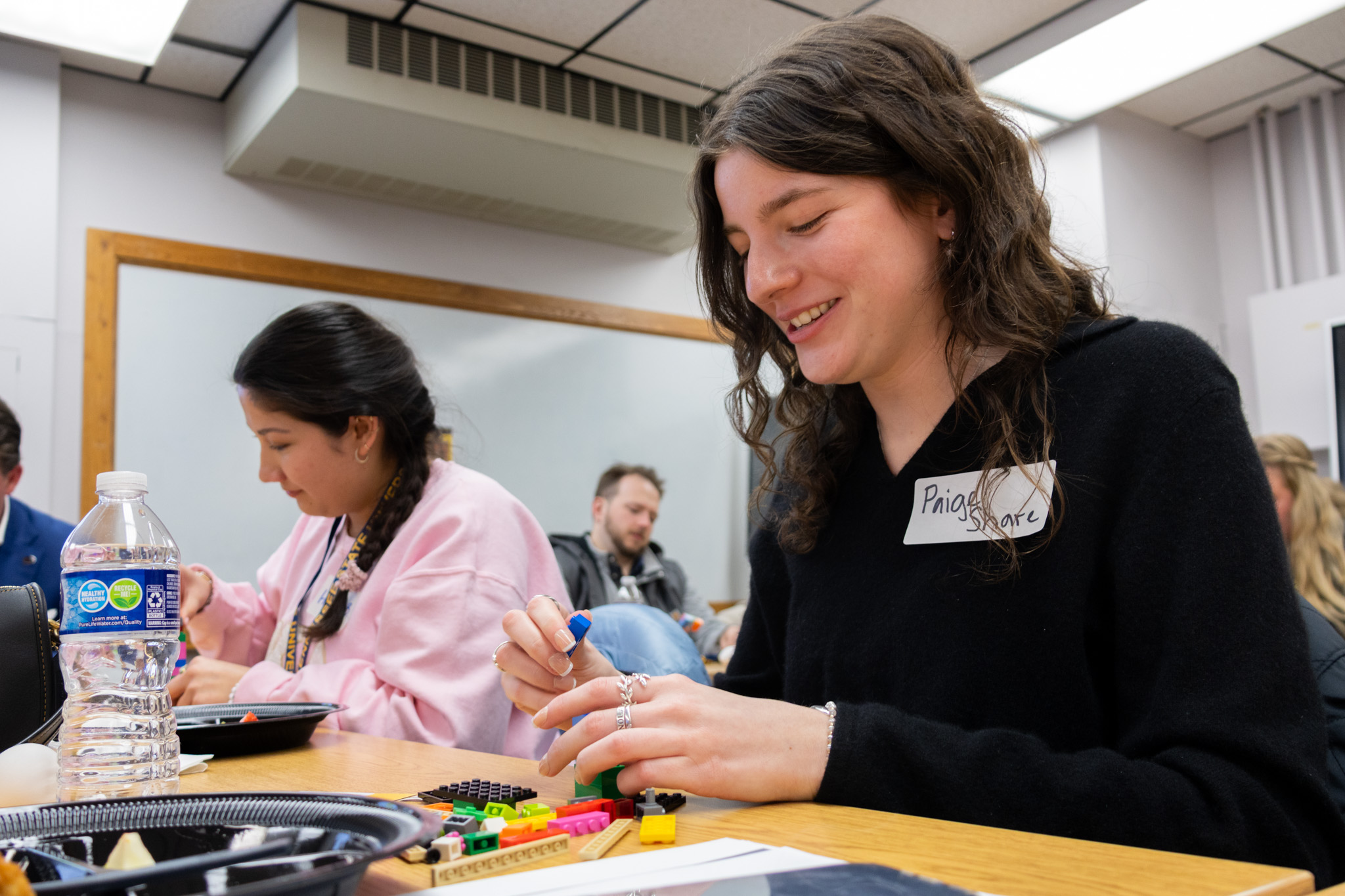 ETSU CBAT student Paige Share smiles as she works on a BucGuide Academy activity.