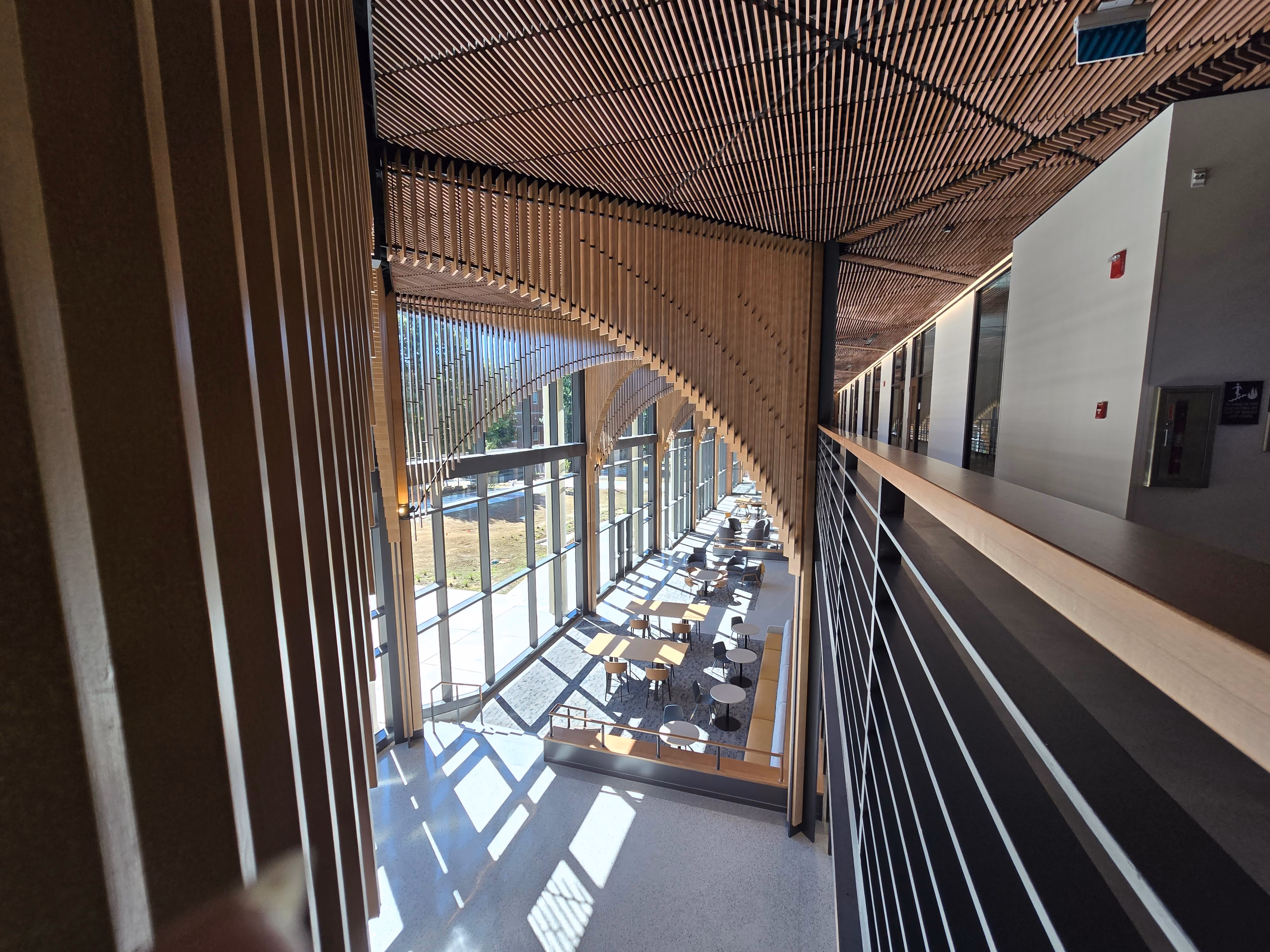 A view from the second floor balcony overlooking the lobby of the new Academic Building.