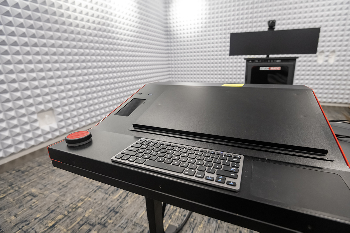 A keyboard in a recording studio with soundproof walls.