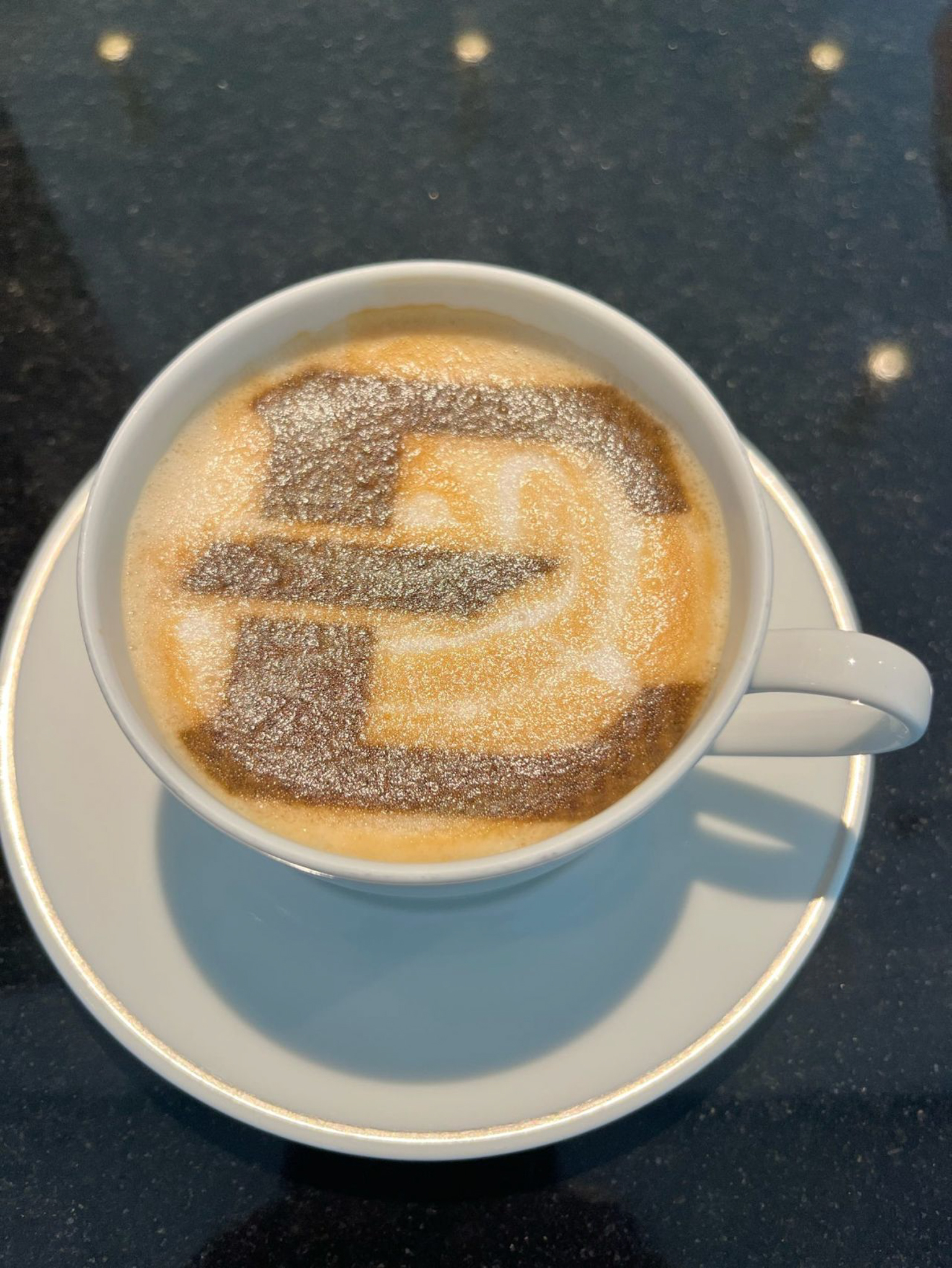 A coffee with an ETSU logo printed on it in Germany.