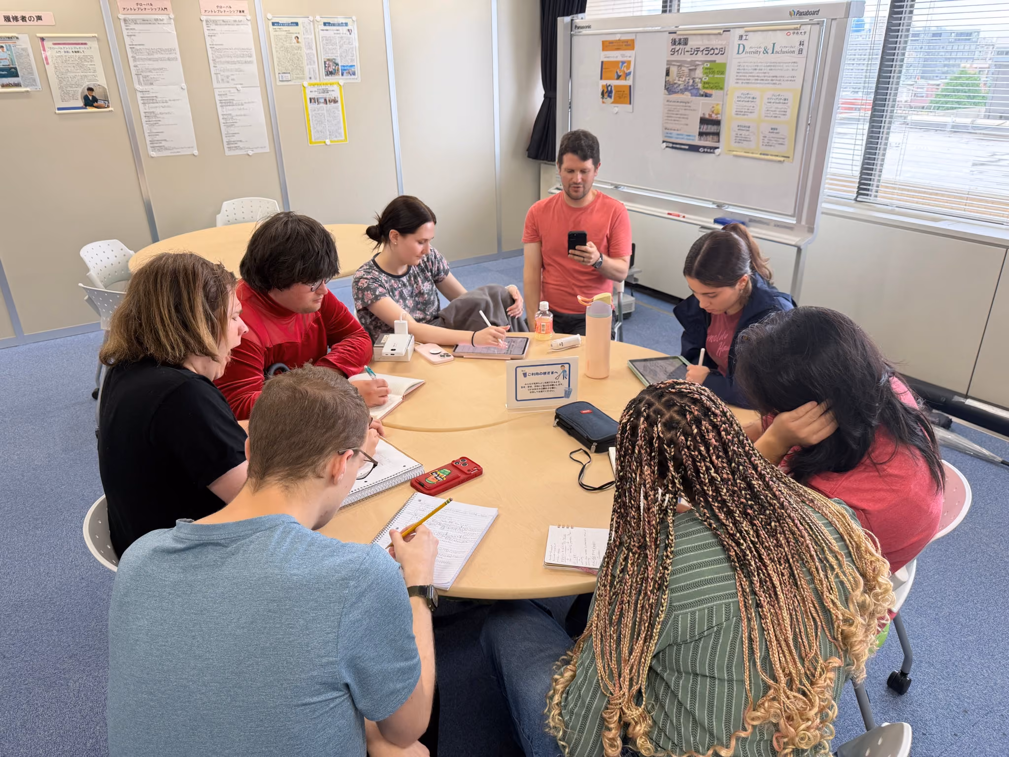 The ETSU CBAT CAS group takes some time to write notes during their trip.