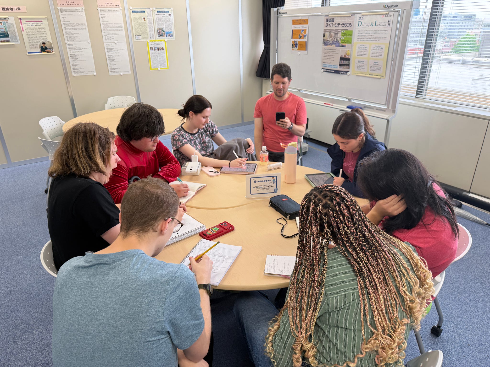 The ETSU CBAT CAS group takes some time to write notes during their trip.