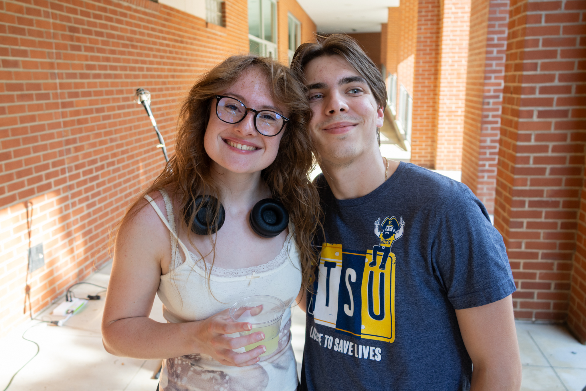 Two ETSU students smile and pose at the computing Welcome Back Bash.